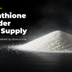 Liposomal glutathione powder shown as a mound of creamy white powder on a dark surface